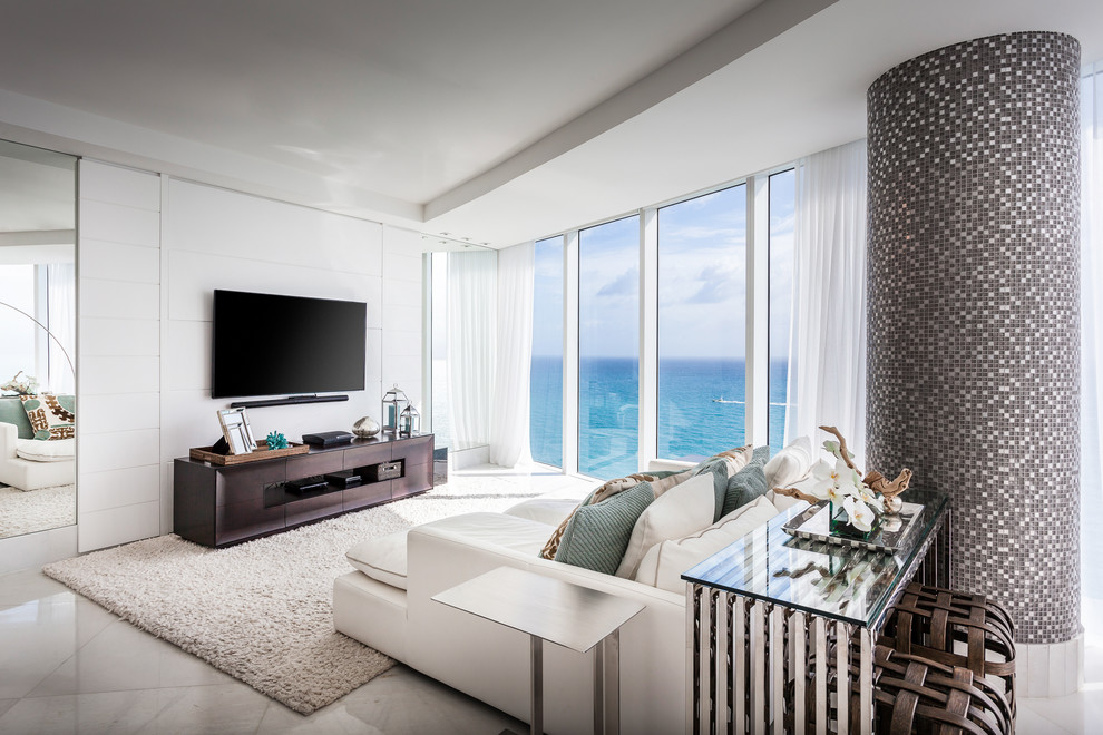 Inspiration for a contemporary open concept family room in Miami with white walls and a wall-mounted tv.