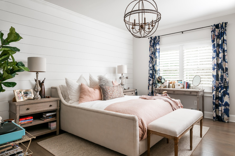 Design ideas for a country bedroom in Atlanta with white walls, medium hardwood floors and brown floor.