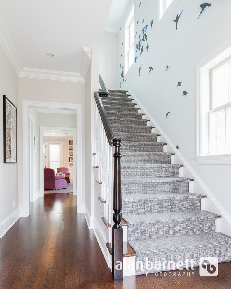 Example of a transitional foyer design in New York