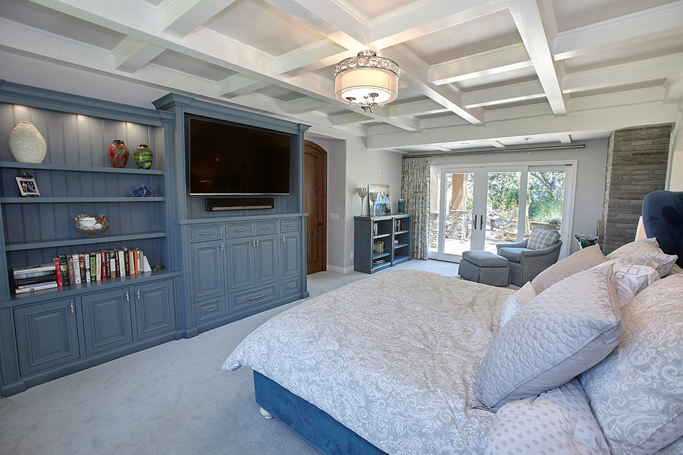 Design ideas for a large transitional master bedroom in San Diego with grey walls, carpet, grey floor, a two-sided fireplace and a stone fireplace surround.