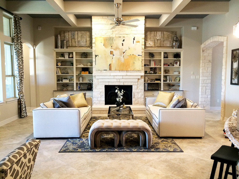 Inspiration for a contemporary open concept ceramic tile living room library remodel in Houston with gray walls, a standard fireplace and a stone fireplace