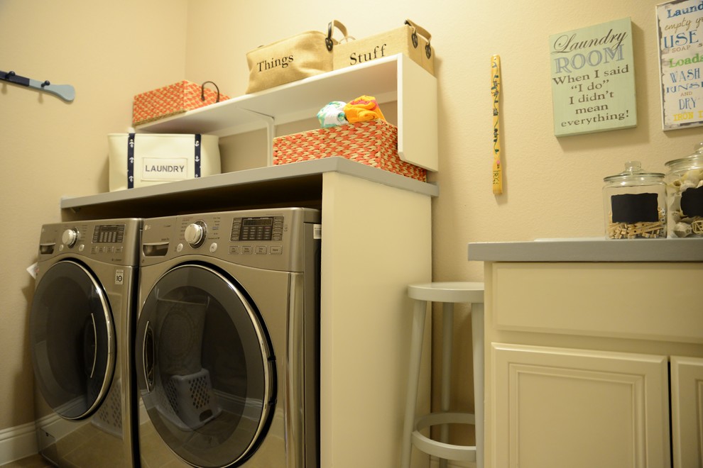 Design ideas for a small transitional single-wall dedicated laundry room in Austin with raised-panel cabinets, white cabinets, wood benchtops, beige walls, ceramic floors and a side-by-side washer and dryer.