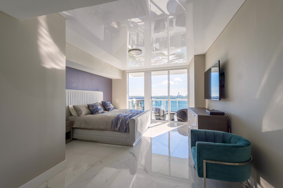 Mid-sized contemporary guest bedroom in Miami with purple walls, marble floors, white floor and wallpaper.