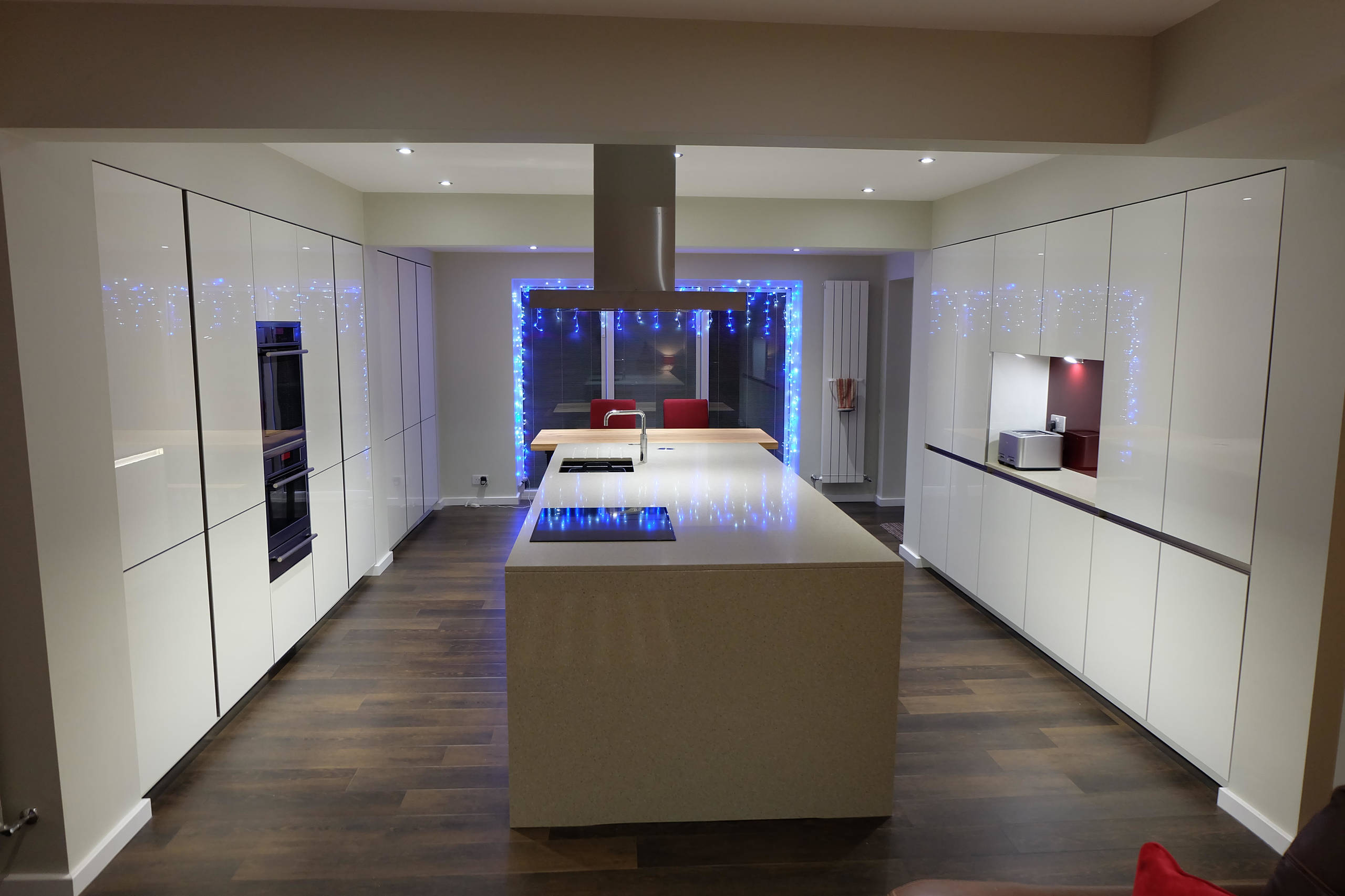 White Gloss Handleless Keller Kitchen with Brescia Stone Work Surfaces