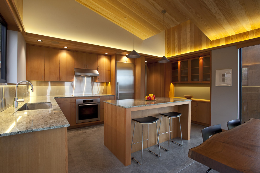 Contemporary l-shaped eat-in kitchen in San Francisco with metallic splashback.