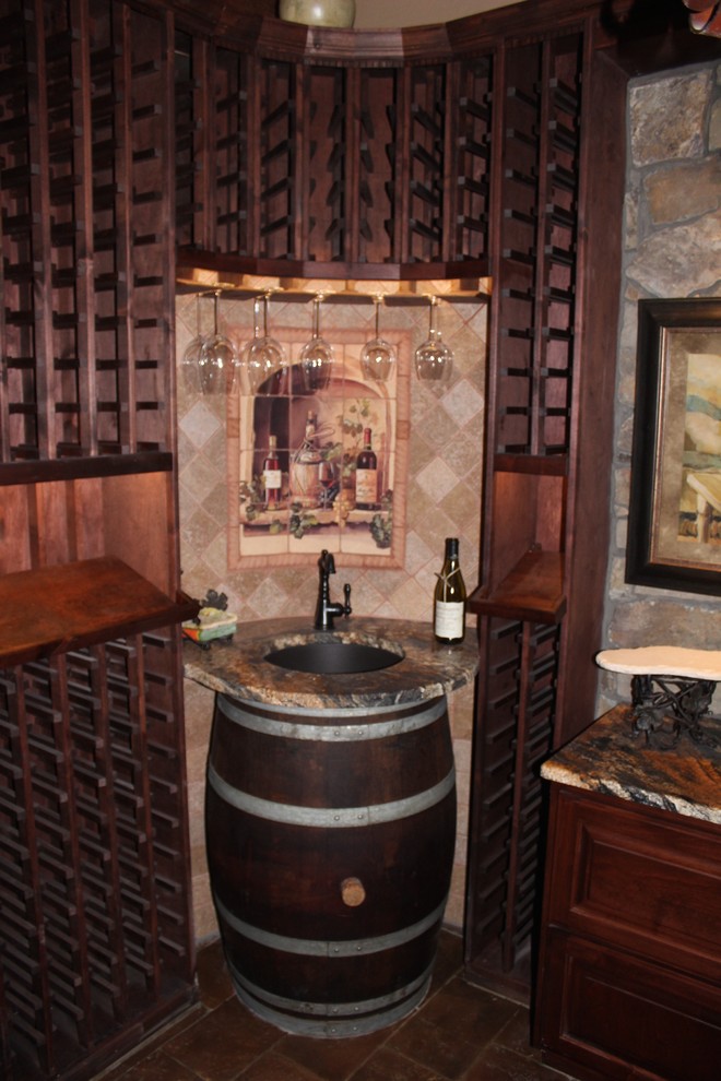 Inspiration for a mid-sized arts and crafts wine cellar in Phoenix with storage racks.