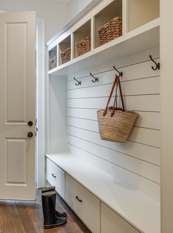 Photo of a country mudroom in Nashville with white walls, dark hardwood floors, a single front door, a white front door and brown floor.