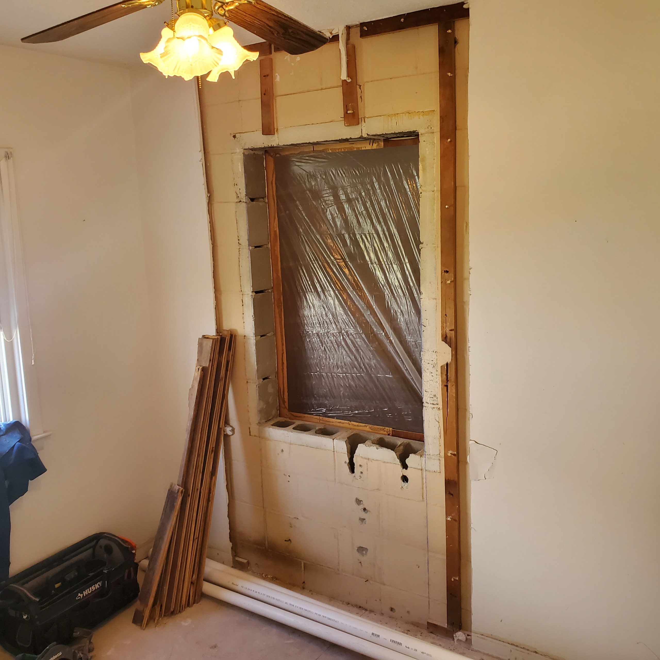 Bedroom to bathroombeginnings of new guest bathroom door.