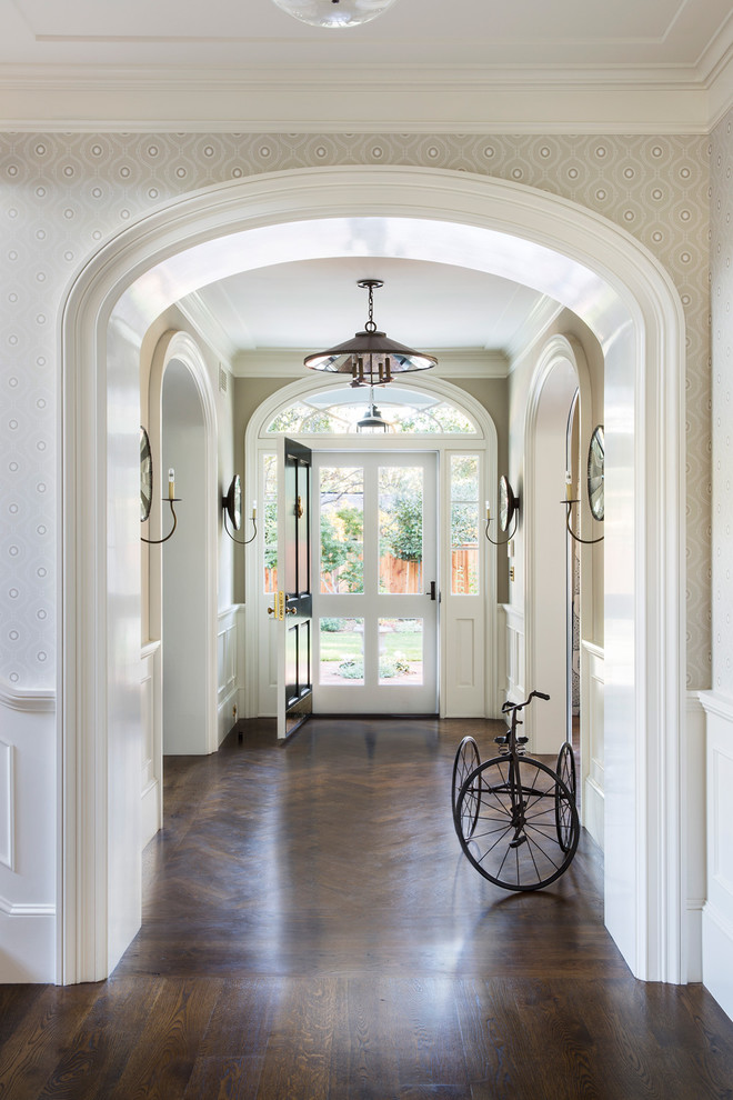 This is an example of a large traditional foyer in San Francisco with grey walls, dark hardwood floors, a single front door, a green front door and brown floor.