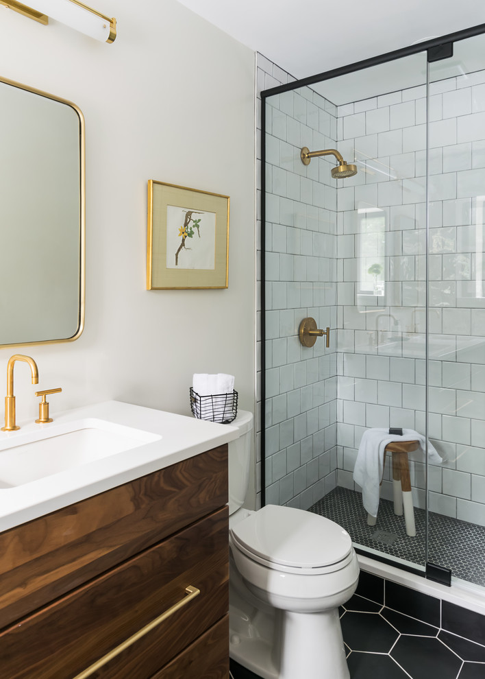 Inspiration for a small transitional 3/4 bathroom in St Louis with flat-panel cabinets, dark wood cabinets, a double shower, a two-piece toilet, white tile, ceramic floors, an undermount sink, engineered quartz benchtops, black floor, a hinged shower door and white benchtops.