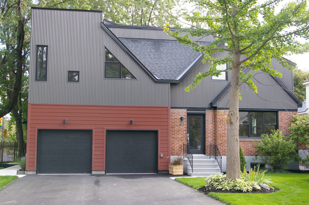 Photo of a mid-sized contemporary three-storey multi-coloured duplex exterior in Ottawa with concrete fiberboard siding, a flat roof and a mixed roof.