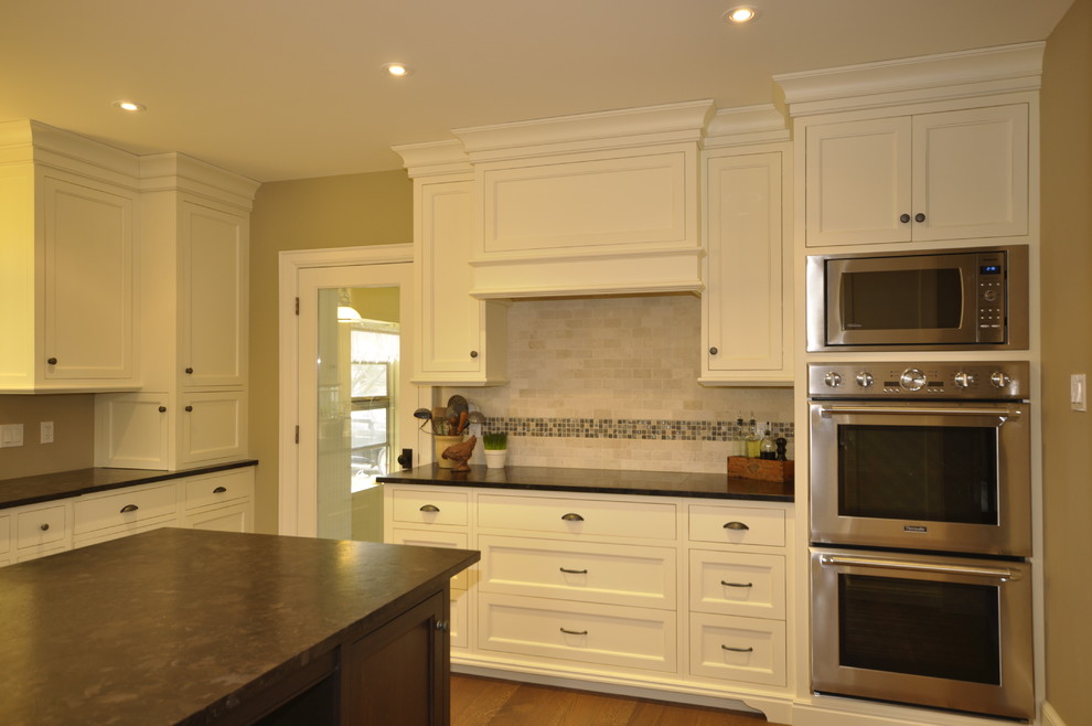 Example of a transitional kitchen design in Toronto