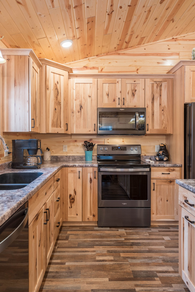 Photo of a mid-sized country l-shaped eat-in kitchen in Minneapolis with an undermount sink, shaker cabinets, medium wood cabinets, laminate benchtops, stainless steel appliances, linoleum floors, with island, multi-coloured floor and turquoise benchtop.