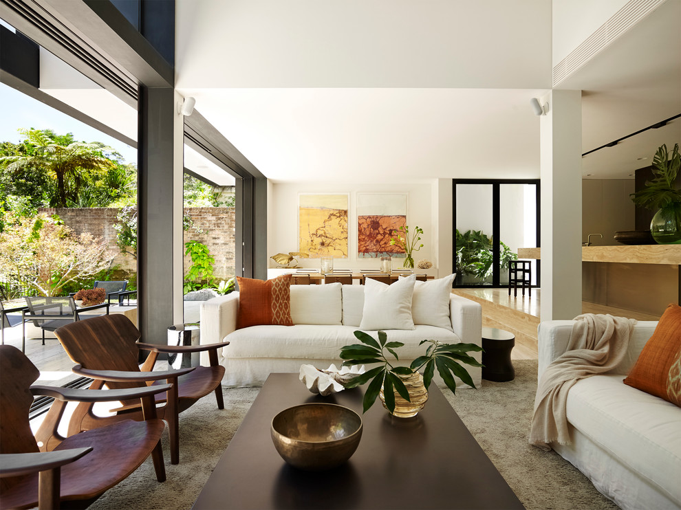 Contemporary formal open concept living room in Sydney with white walls, no fireplace and no tv.