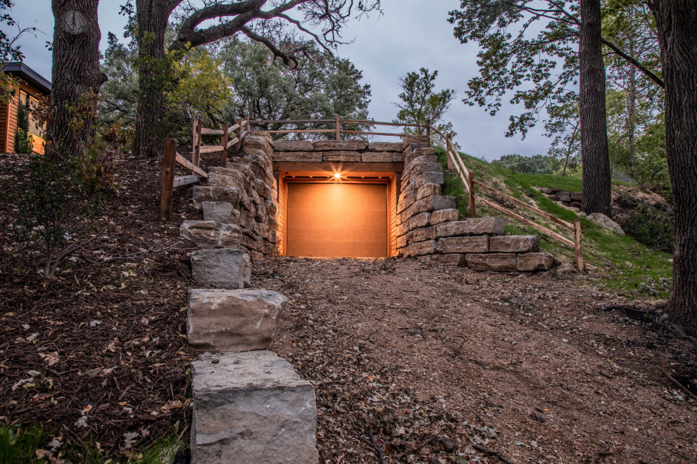 Example of a huge urban attached four-car garage design