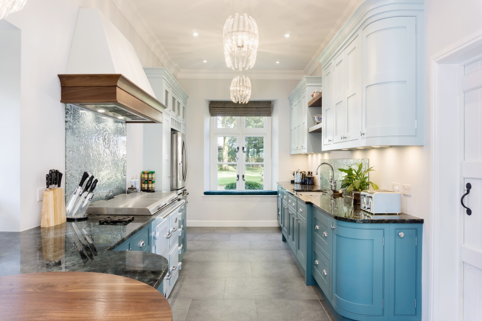Design ideas for a large classic galley kitchen in Other with a built-in sink, recessed-panel cabinets, blue cabinets, granite worktops, coloured appliances, ceramic flooring and black worktops.