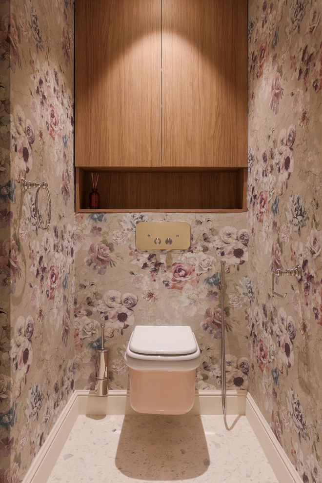 Medium sized traditional cloakroom in Nice with beaded cabinets, beige cabinets, a wall mounted toilet, multi-coloured walls, terrazzo flooring, a wall-mounted sink, white floors, a built in vanity unit, a wallpapered ceiling and wallpapered walls.
