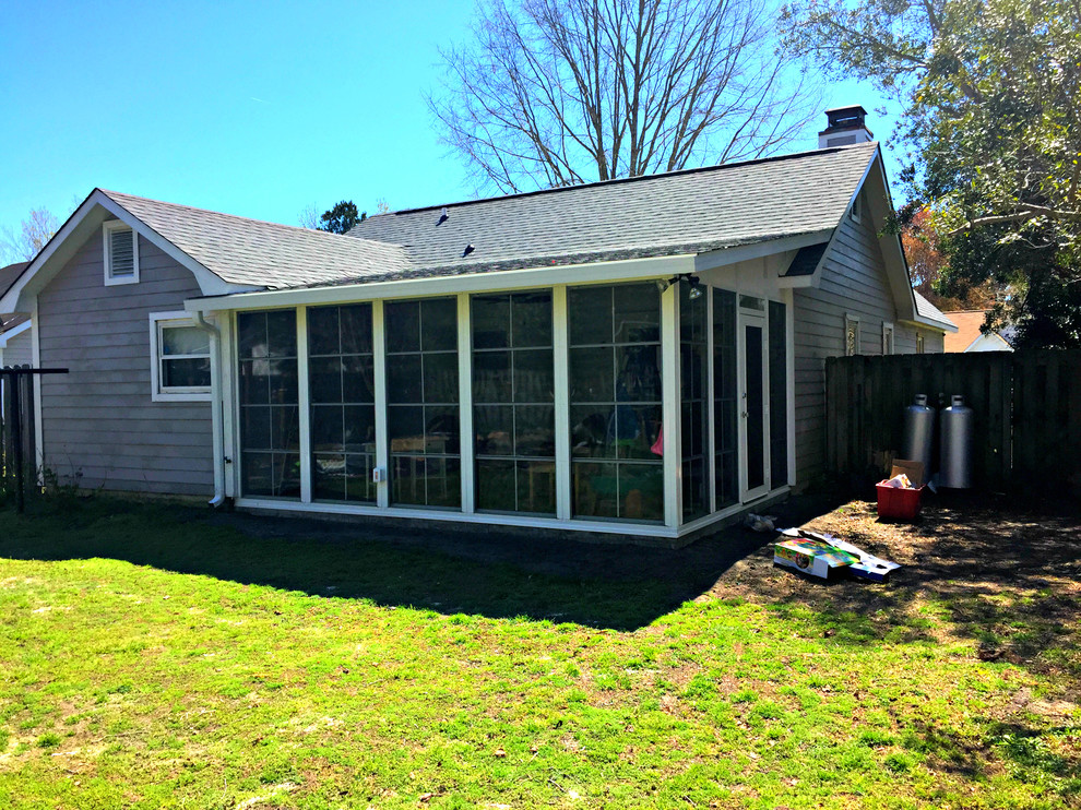 This is an example of a large transitional sunroom in Wilmington with a standard ceiling and no fireplace.