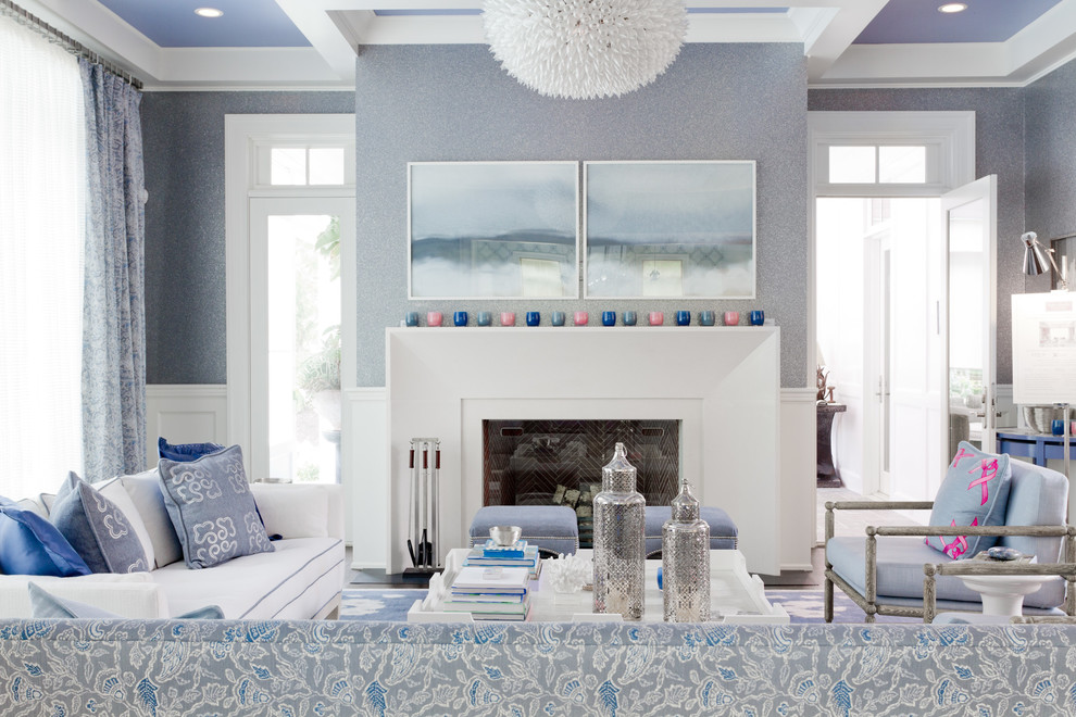 Inspiration for a transitional living room in New York with blue walls, a standard fireplace and no tv.