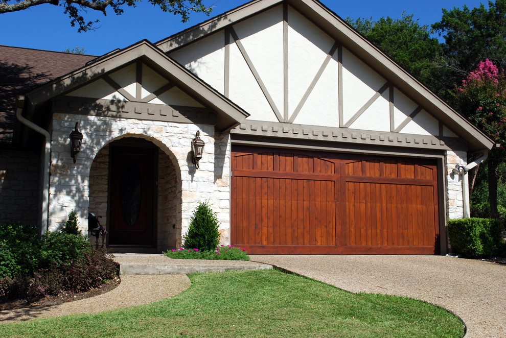 Photo of a large traditional attached two-car garage in Austin.