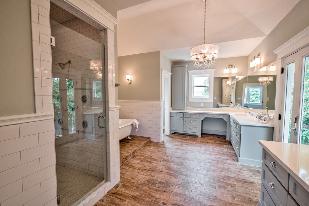 Design ideas for a large transitional master bathroom in Houston with an undermount sink, shaker cabinets, white cabinets, quartzite benchtops, a claw-foot tub, a double shower, a two-piece toilet, white tile, ceramic tile, brown walls and porcelain floors.