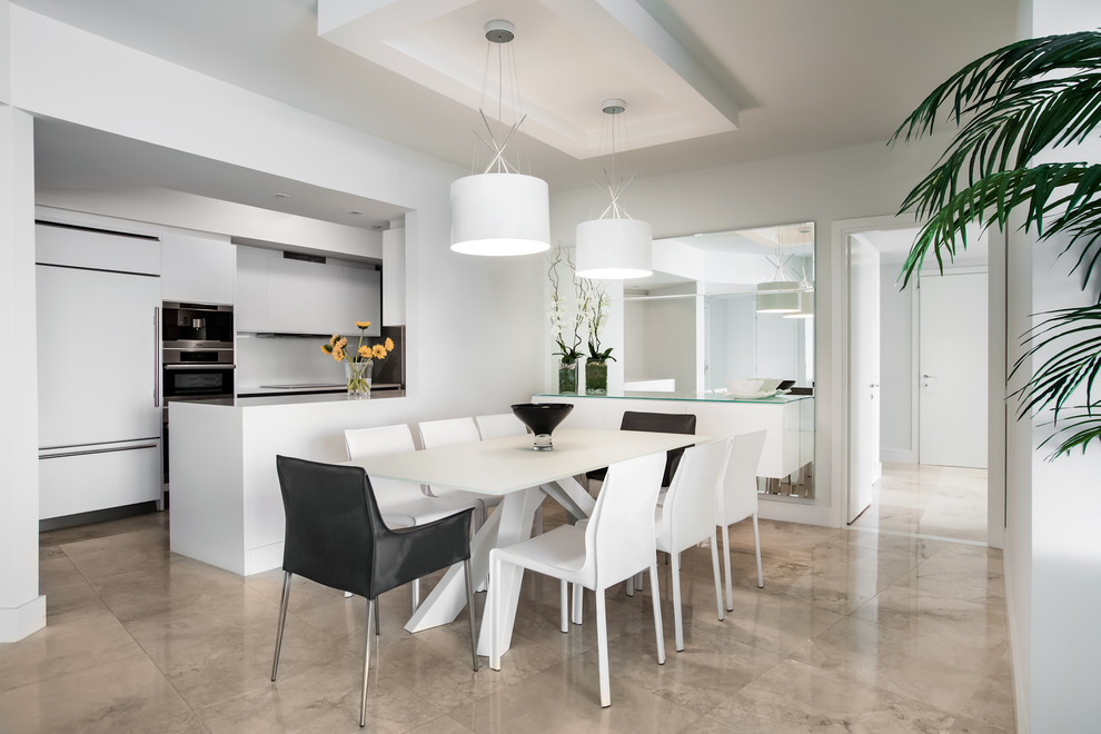 Design ideas for a contemporary kitchen/dining combo in Miami with white walls.