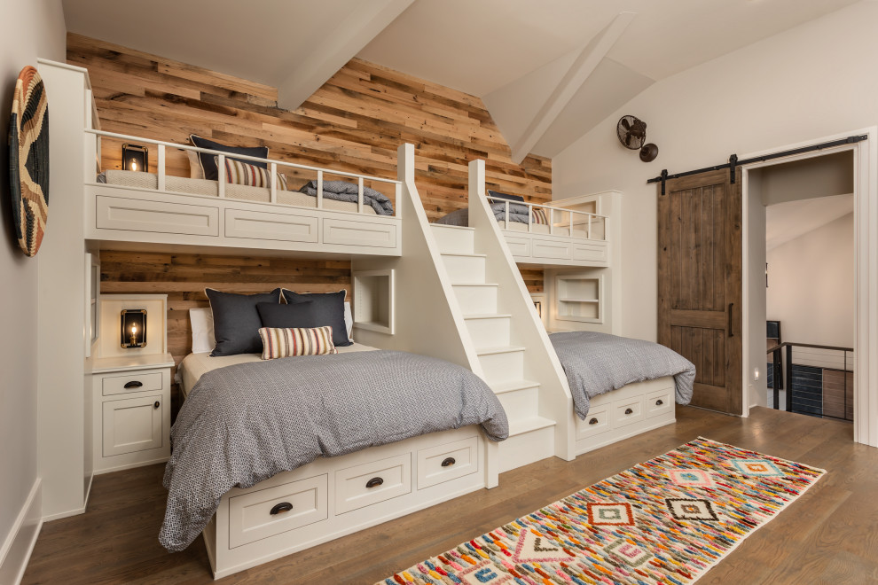 This is an example of a rustic kids' bedroom in Other with wallpapered walls.
