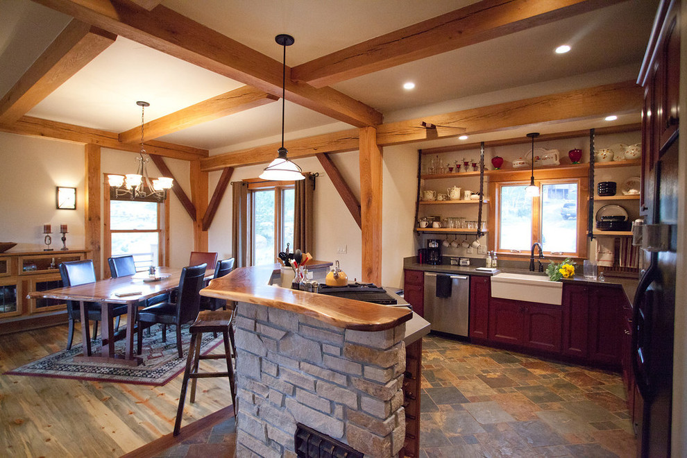 Design ideas for a mid-sized country eat-in kitchen in Denver with a farmhouse sink, recessed-panel cabinets, red cabinets, quartzite benchtops, grey splashback, stone slab splashback, stainless steel appliances, slate floors, with island and multi-coloured floor.