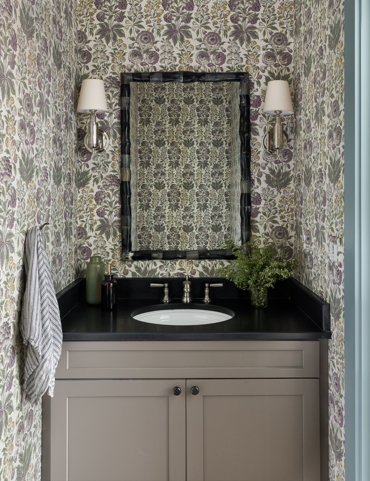 Inspiration for a transitional powder room in Seattle with shaker cabinets, grey cabinets, multi-coloured walls, an undermount sink and black benchtops.