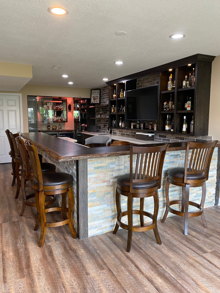 Mid-sized eclectic u-shaped seated home bar in Other with an undermount sink, wood benchtops, vinyl floors, beige floor and brown benchtop.