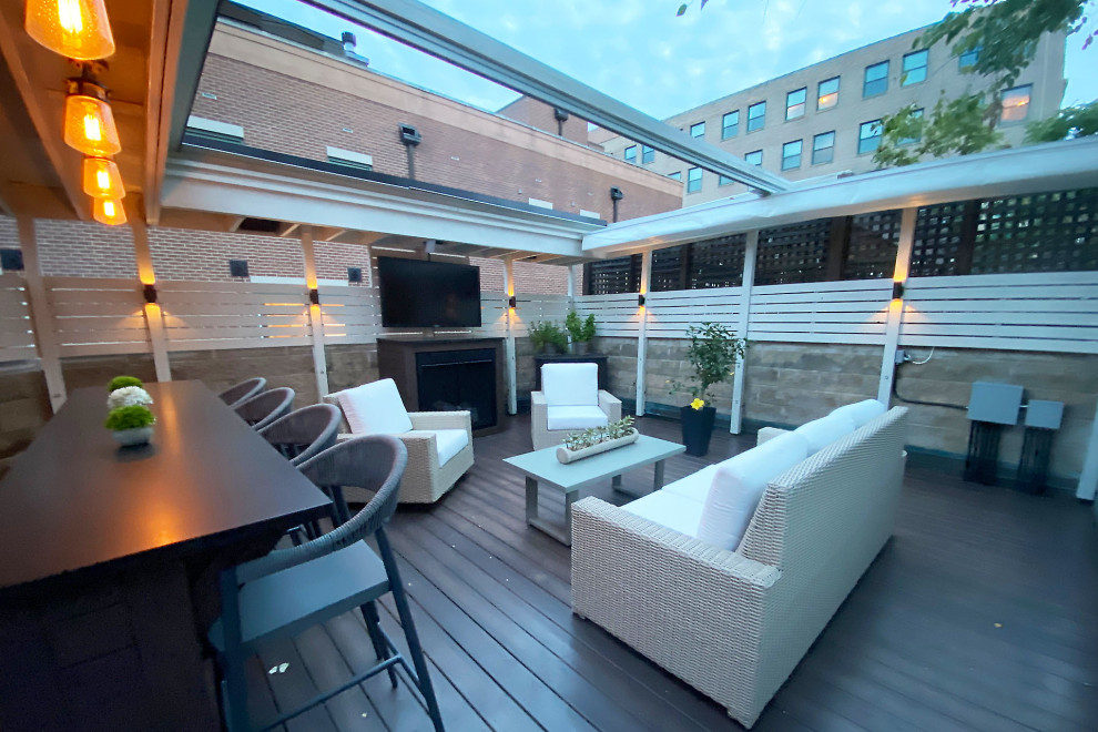 Inspiration for a world-inspired back private and first floor mixed railing terrace in Chicago with a pergola.