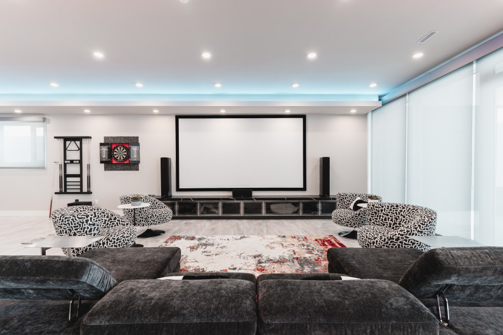 Design ideas for a contemporary home theatre in Edmonton with grey walls, a projector screen and grey floor.