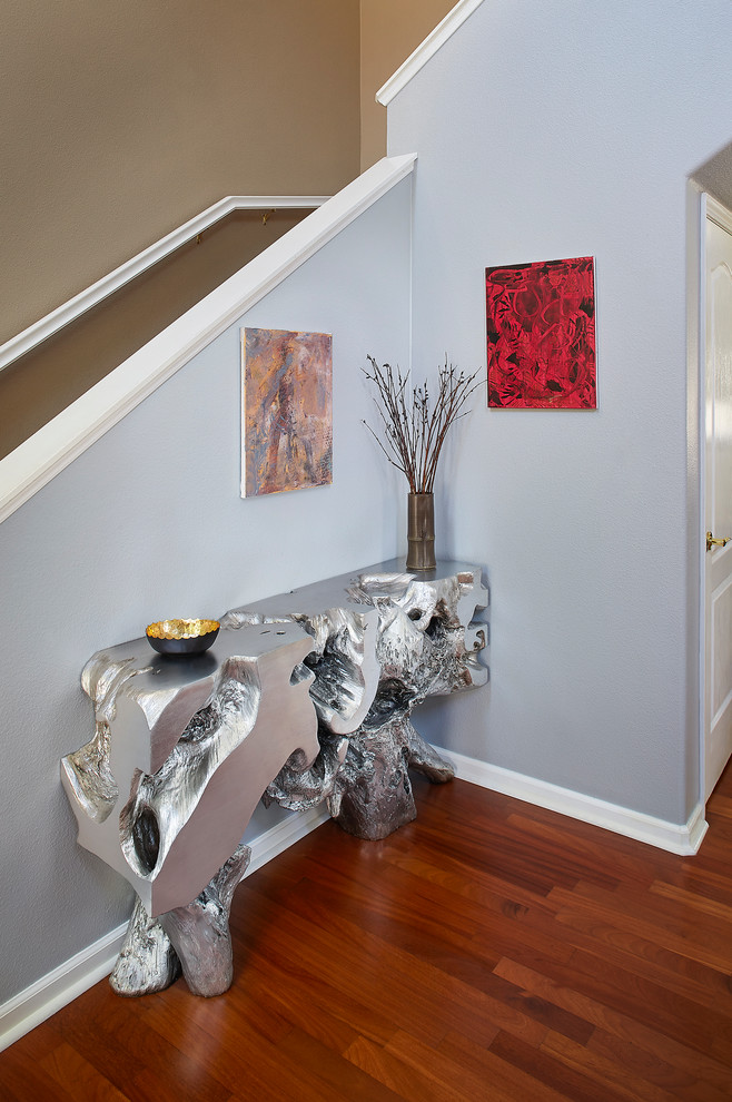 This is an example of a contemporary entryway in San Francisco with medium hardwood floors and grey walls.