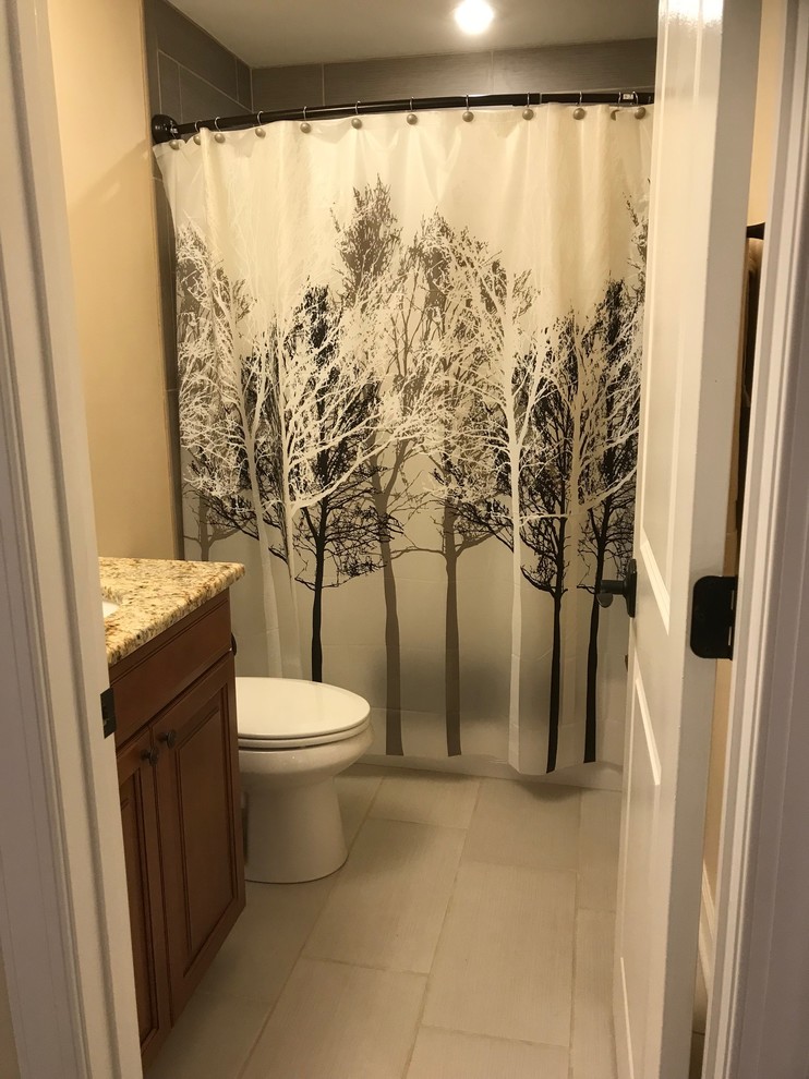 Finished Basement Bathroom with Ceramic tiled tub and floor