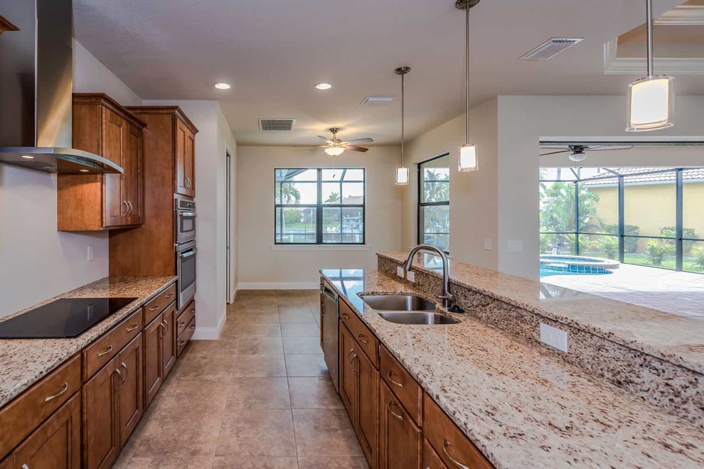 Example of a transitional kitchen design in Miami