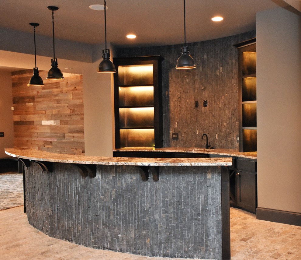 This is an example of a large arts and crafts single-wall wet bar in Kansas City with an undermount sink, shaker cabinets, dark wood cabinets, granite benchtops, grey splashback, stone tile splashback and brick floors.
