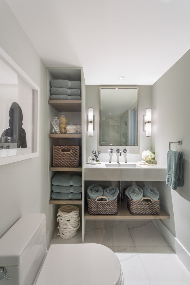 Design ideas for a mid-sized contemporary master bathroom in Miami with open cabinets, light wood cabinets, white tile, stone tile, grey walls, marble floors, a one-piece toilet, an integrated sink and concrete benchtops.
