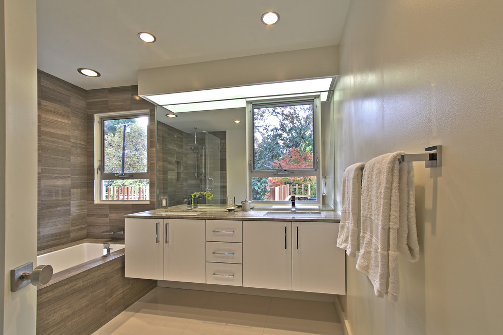 Photo of a large midcentury bathroom in Los Angeles with flat-panel cabinets, medium wood cabinets, light hardwood floors, beige floor and exposed beam.
