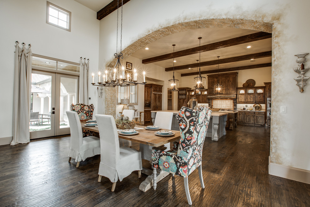 Inspiration for an expansive mediterranean open plan dining in Dallas with beige walls and medium hardwood floors.