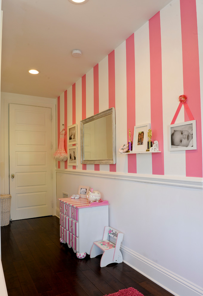 Mid-sized traditional kids' room in Miami with carpet and multi-coloured walls for girls.