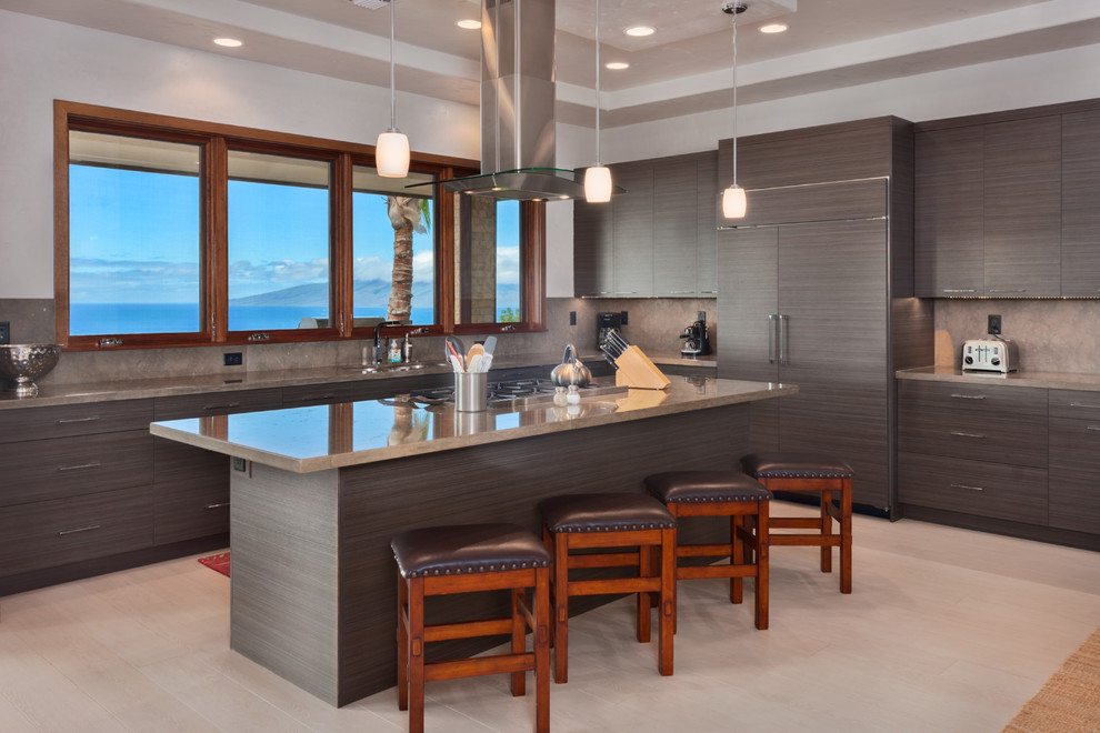 Inspiration for a large contemporary l-shaped separate kitchen in Hawaii with porcelain floors, flat-panel cabinets, brown cabinets, limestone benchtops, beige splashback, stone slab splashback, panelled appliances, with island and beige floor.