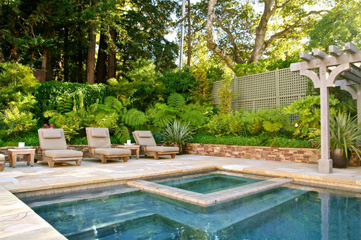 Inspiration for a large transitional backyard partial sun formal garden for summer in San Francisco with natural stone pavers and with pond.