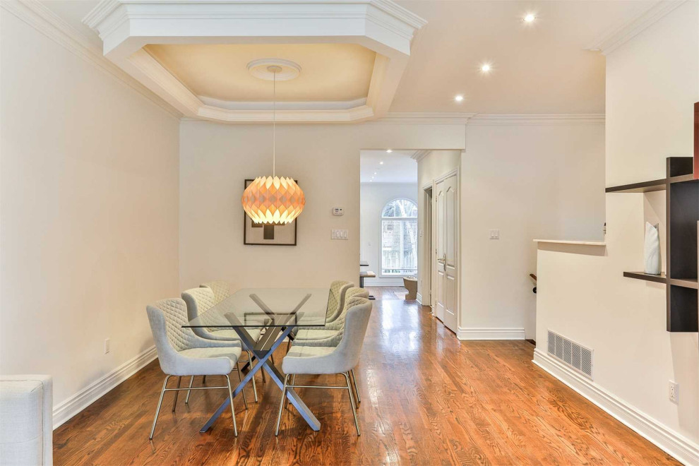 Transitional dining room photo in Toronto