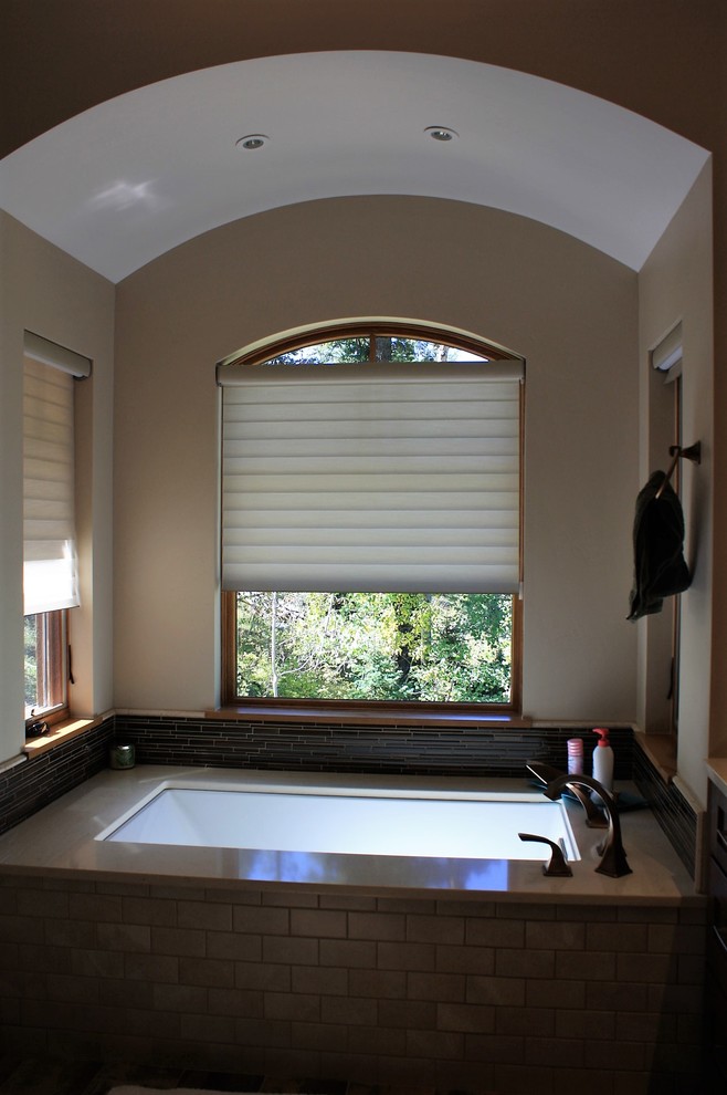 Inspiration for a large rustic master brown floor bathroom remodel with an undermount tub and quartz countertops