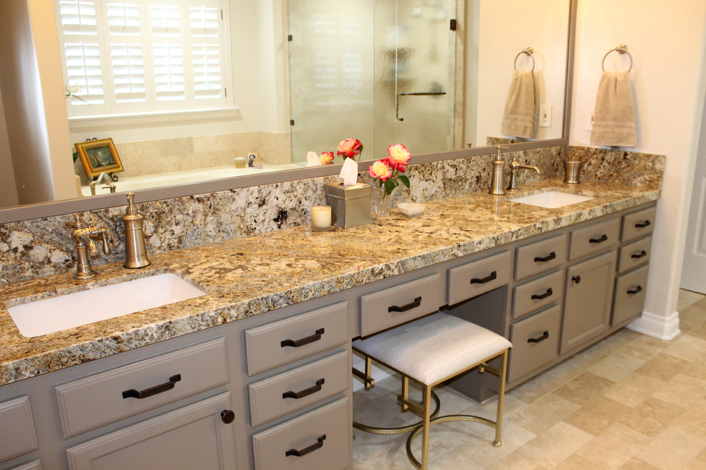 Large transitional master bathroom in Los Angeles with raised-panel cabinets, beige cabinets, a hot tub, a corner shower, a two-piece toilet, beige tile, travertine, beige walls, travertine floors, an undermount sink, granite benchtops, beige floor and a hinged shower door.