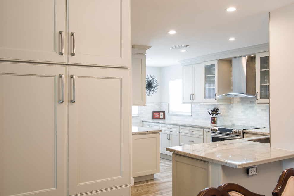 Small transitional porcelain tile and beige floor kitchen photo in Miami with an undermount sink, recessed-panel cabinets, beige cabinets, granite countertops, gray backsplash, subway tile backsplash, stainless steel appliances and beige countertops