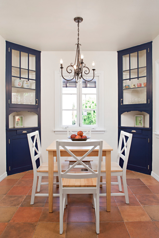 Kitchen/dining room combo - mid-sized cottage terra-cotta tile kitchen/dining room combo idea in Atlanta with a farmhouse sink, shaker cabinets, quartz countertops, yellow backsplash, glass tile backsplash and white walls