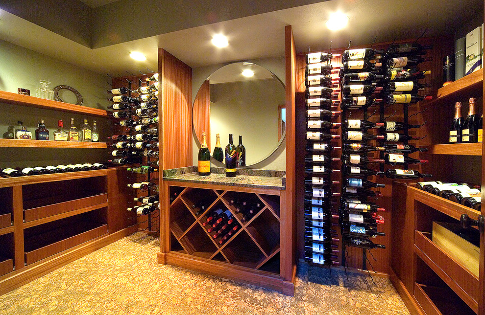 This is an example of a mid-sized asian wine cellar in Other with cork floors and storage racks.