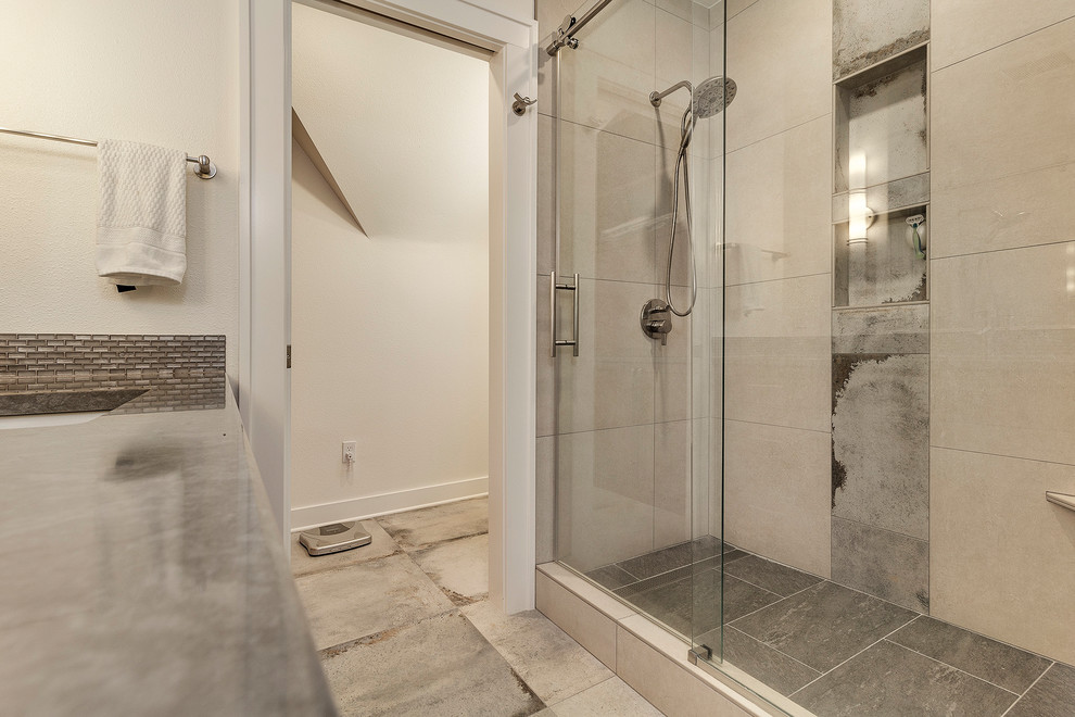 This is an example of a mid-sized modern master bathroom in Portland with shaker cabinets, medium wood cabinets, an alcove shower, a two-piece toilet, beige tile, glass tile, beige walls, porcelain floors, an undermount sink, quartzite benchtops, grey floor, a sliding shower screen and grey benchtops.