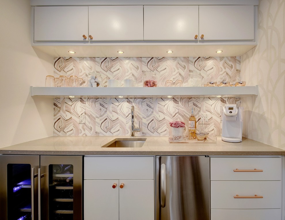 Design ideas for a transitional single-wall wet bar in Austin with an undermount sink, flat-panel cabinets, white cabinets, pink splashback and grey benchtop.